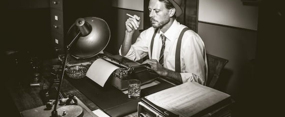 Retro reporter working late typing on a typewriter and smoking a cigarette.